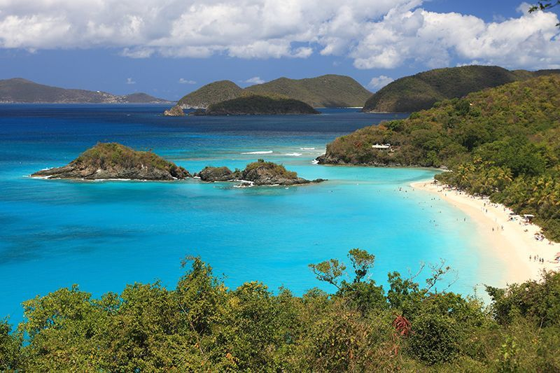 blue water and sandy beach among the islands